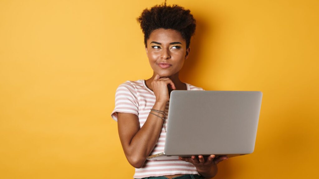 Woman thinking about taking up online course